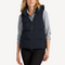 Front view of women’s navy waterproof puffer vest on model – Louvóre apparel